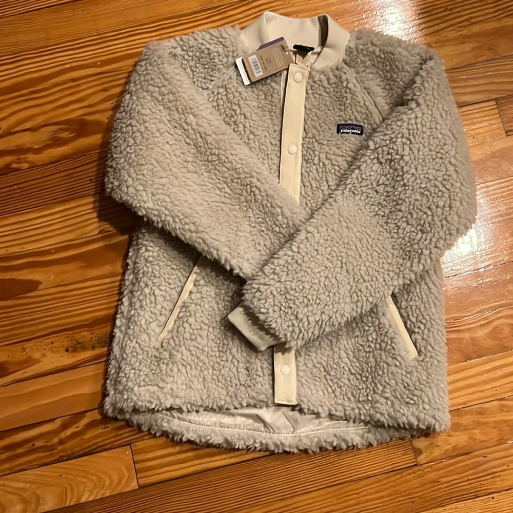 Patagonia. Girls. Size 12. New with tags. Very cute jacket.